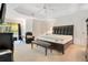Large main bedroom with a king-size bed, plush carpeting, and ceiling fan at 1434 Hidden Meadow Way, Apopka, FL 32712