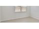 Simple bedroom with neutral walls and carpet at 8039 Northlake Pkwy, Orlando, FL 32827