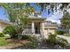 Two-story house with front porch, two-car garage, and landscaping at 8039 Northlake Pkwy, Orlando, FL 32827