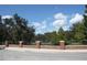 Brick wall with black metal railing along a pond at 8039 Northlake Pkwy, Orlando, FL 32827