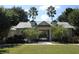 Community pool house entrance with lush landscaping at 8039 Northlake Pkwy, Orlando, FL 32827