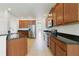 Kitchen with stainless steel appliances and granite countertops at 8039 Northlake Pkwy, Orlando, FL 32827
