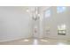 Bright living room with high ceilings and tile floors at 8039 Northlake Pkwy, Orlando, FL 32827