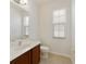 Clean bathroom with single vanity and tiled floors at 8039 Northlake Pkwy, Orlando, FL 32827