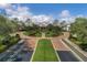 Elegant community clubhouse with circular driveway and landscaping at 2366 Prairie Dunes, Clermont, FL 34711
