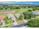 Community overview showcasing homes with lush landscaping and a golf course at 2366 Prairie Dunes, Clermont, FL 34711