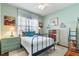 Quaint bedroom with a full-size bed and wood floors at 2366 Prairie Dunes, Clermont, FL 34711