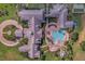 Aerial view of community clubhouse with pool and surrounding landscape at 2366 Prairie Dunes, Clermont, FL 34711