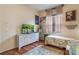 Cozy bedroom with a twin bed and hardwood floors at 2366 Prairie Dunes, Clermont, FL 34711