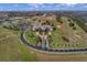 Aerial view of community clubhouse with golf course and tennis courts at 2366 Prairie Dunes, Clermont, FL 34711