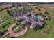 Aerial view of community clubhouse, pool, and parking area at 2366 Prairie Dunes, Clermont, FL 34711