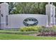 Summit Greens community entrance with lush landscaping and elegant signage at 2366 Prairie Dunes, Clermont, FL 34711