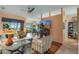 Open living room featuring hardwood floors, a fireplace, and ample natural light at 2366 Prairie Dunes, Clermont, FL 34711