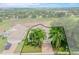 Property view highlighting a house with palm trees and a brick driveway at 2366 Prairie Dunes, Clermont, FL 34711