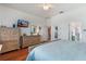 Bright bedroom with wood floors and ample closet space at 2366 Prairie Dunes, Clermont, FL 34711