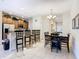 Kitchen with stainless steel appliances and breakfast bar at 8967 California Palm Rd, Kissimmee, FL 34747