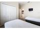 Two twin beds, closet, and view of bathroom from this bedroom at 8967 California Palm Rd, Kissimmee, FL 34747