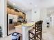 Kitchen with stainless steel appliances and breakfast bar at 8967 California Palm Rd, Kissimmee, FL 34747