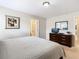 Spacious bedroom with a dresser and large bed at 8967 California Palm Rd, Kissimmee, FL 34747