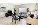 Living Room with light colored couches and coffee table at 8967 California Palm Rd, Kissimmee, FL 34747