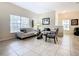 Living room with light colored couches and coffee table at 8967 California Palm Rd, Kissimmee, FL 34747