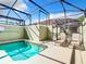 Private screened-in pool with lounge chairs at 8967 California Palm Rd, Kissimmee, FL 34747