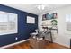 Home office with hardwood floors and built-in shelving at 115 Marcy Blvd, Longwood, FL 32750