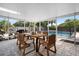 Relaxing screened patio with wooden dining set overlooking the pool at 115 Marcy Blvd, Longwood, FL 32750