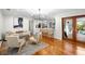Bright living room showcasing hardwood floors and access to a patio at 115 Marcy Blvd, Longwood, FL 32750
