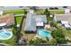 Aerial view of house, fenced backyard, and pool at 115 Marcy Blvd, Longwood, FL 32750
