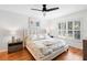 Main bedroom with a king-size bed and access to the backyard at 115 Marcy Blvd, Longwood, FL 32750