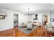 Spacious living room with hardwood floors and a modern chandelier at 115 Marcy Blvd, Longwood, FL 32750