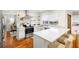 Modern kitchen with white cabinets, quartz countertops, and stainless steel appliances at 115 Marcy Blvd, Longwood, FL 32750
