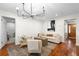 Light and airy living room with hardwood floors and access to other rooms at 115 Marcy Blvd, Longwood, FL 32750