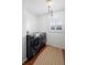 Bright laundry room with modern washer and dryer, and a woven rug at 115 Marcy Blvd, Longwood, FL 32750
