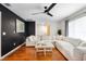 Spacious living room featuring a large sectional sofa and hardwood floors at 115 Marcy Blvd, Longwood, FL 32750