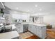 Modern kitchen with white cabinets, quartz countertops, and stainless steel appliances at 115 Marcy Blvd, Longwood, FL 32750