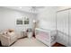 Charming bedroom with crib and play area at 115 Marcy Blvd, Longwood, FL 32750
