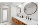 Modern bathroom with double vanity and large mirrors at 115 Marcy Blvd, Longwood, FL 32750