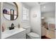 Clean bathroom with white vanity, toilet, and a view of a Bedroom at 115 Marcy Blvd, Longwood, FL 32750