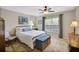 Bright bedroom with comfortable bed, ample natural light, and neutral decor at 191 Blackstone Creek Rd, Groveland, FL 34736