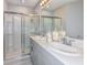 Bathroom with double sinks and a shower at 156 Brinsmead Rd, Haines City, FL 33844