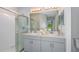 Elegant bathroom with dual sinks, a shower, and modern vanity at 156 Brinsmead Rd, Haines City, FL 33844