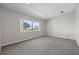 Bright bedroom with gray carpet and large window at 2009 Lakeshore Blvd, Saint Cloud, FL 34769