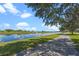 Peaceful waterfront pathway with lush trees and a canal at 2009 Lakeshore Blvd, Saint Cloud, FL 34769