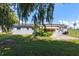 Backyard view showing home's exterior and patio at 2009 Lakeshore Blvd, Saint Cloud, FL 34769