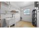 Laundry room with utility sink and shelving at 2009 Lakeshore Blvd, Saint Cloud, FL 34769