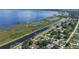 Aerial view of waterfront property with canal access and nearby homes at 2009 Lakeshore Blvd, Saint Cloud, FL 34769