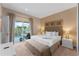 King-size bed, balcony access, and plenty of natural light at 3175 Brasilia Ave, Kissimmee, FL 34747