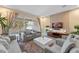 Open living room with patio access and large TV at 3175 Brasilia Ave, Kissimmee, FL 34747